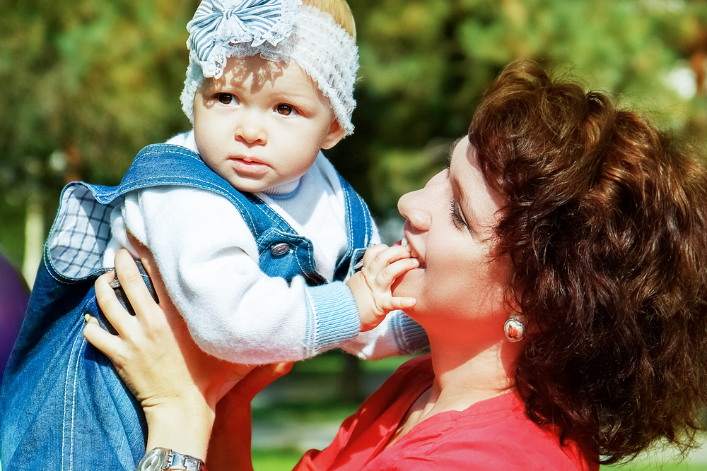 mother-lifting-baby